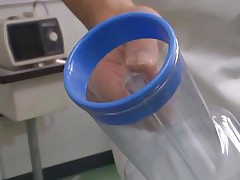 She really really needs to piss and her colleague give her a helping hand but ends up covered in her piss. Yuna takes off her panties, sits on the operation table and as the guy holds a recipient for her to urinate in she begins to pee. Not only that she urinated all over the place but she did it on the camera too!